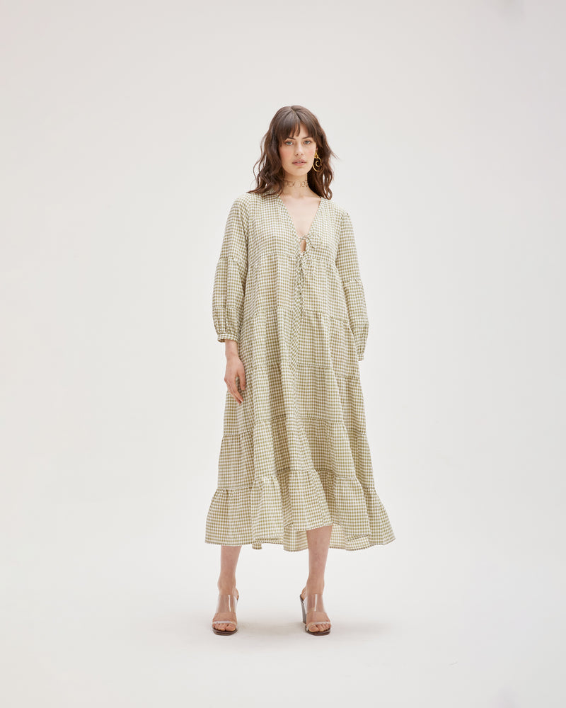 WREN TIERED MAXI DRESS KHAKI GINGHAM | Longsleeve tiered maxi dress with V-neck and tie closure. Balloon sleeves and tiered ruching throughout the body gives this piece a floaty silhouette.