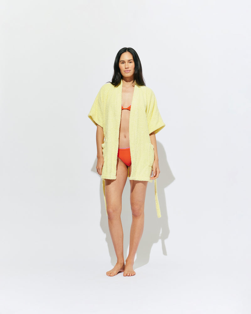 BEACH ROBE BUTTER | The ultimate poolside accessory, our very own RUBY beach robe! A mini length fit designed in a soft cotton towelling, with our diving girl patch design on the hem. 