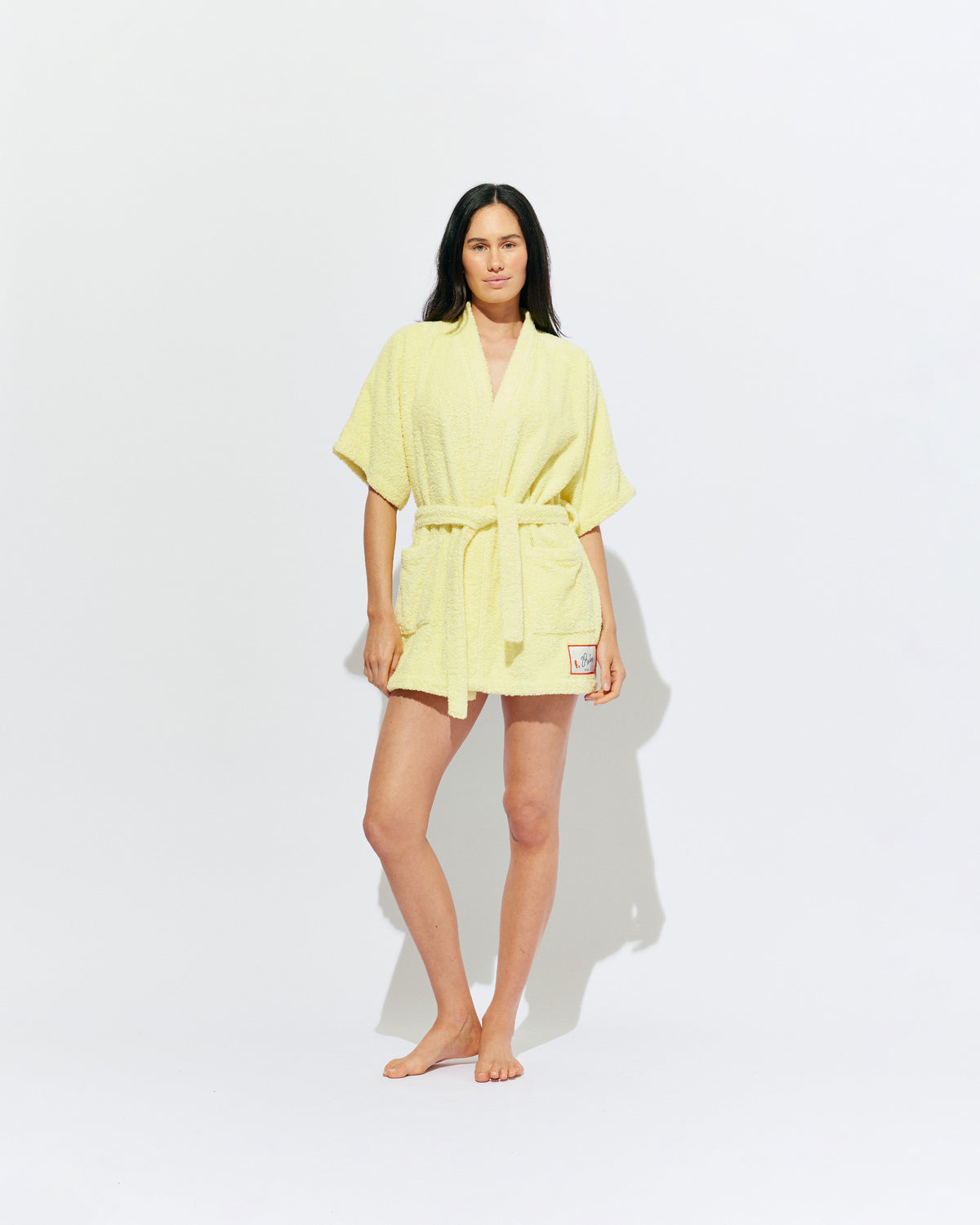 BEACH ROBE BUTTER | The ultimate poolside accessory, our very own RUBY beach robe! A mini length fit designed in a soft cotton towel material, with our diving girl patch design on the hem. 
