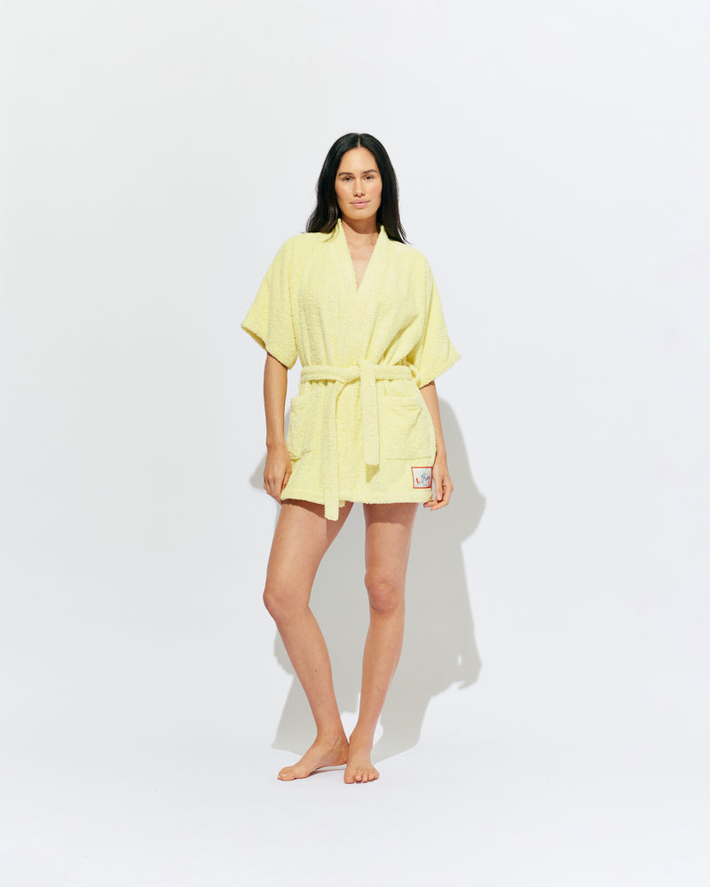 BEACH ROBE BUTTER | The ultimate poolside accessory, our very own RUBY beach robe! A mini length fit designed in a soft cotton towelling, with our diving girl patch design on the hem. 