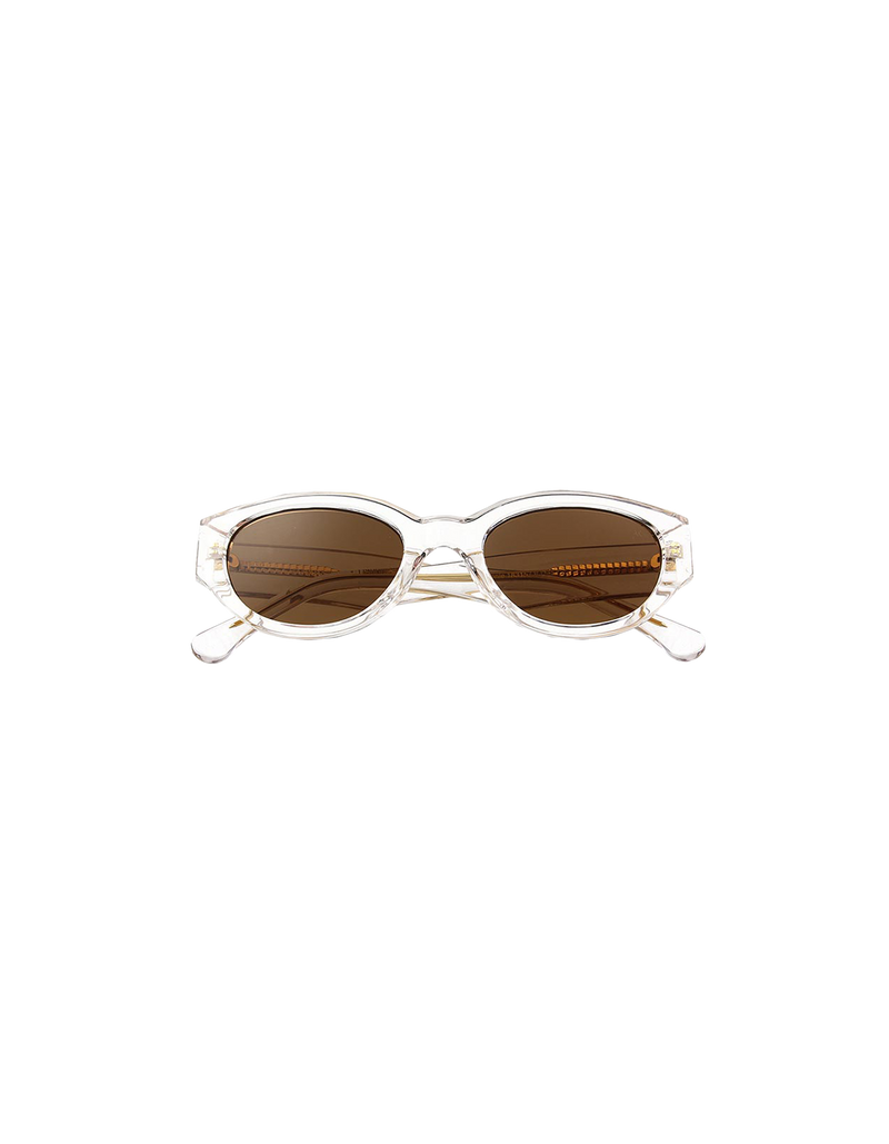  WINNIE SUNGLASS CRYSTAL | The Winnie by A.Kjaerbede is a futuristic cat eye sunglass with clear frames and brown tinted lens.