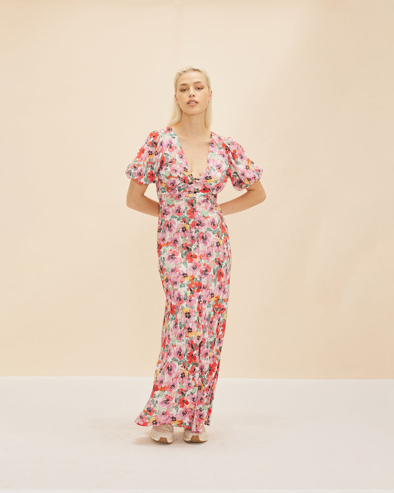 ALLEGRA SILK MIDI DRESS PANSY | Bias cut puff sleeve maxi dress crafted in our RUBY pansy floral with self covered buttons down the front and a centre front split. The silk creates a beautiful drape...