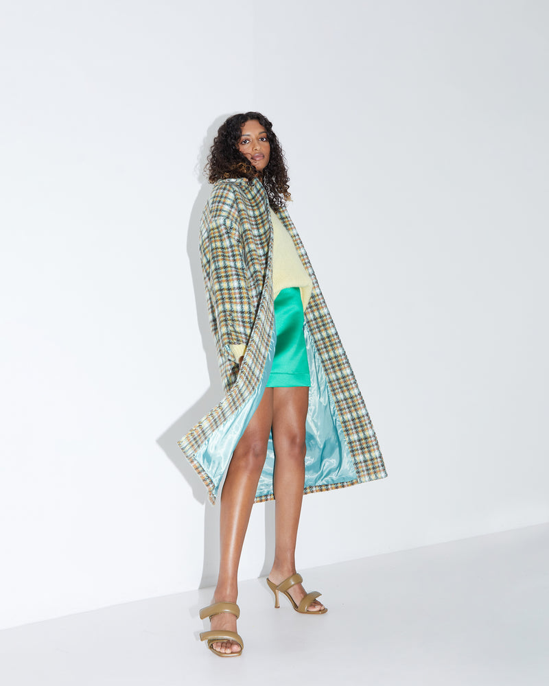 BASIL COAT TARTAN | Oversized drop shoulder coat in a pastel tartan, with a slim lapel and collar. Made in a weighty wool blend that is wonderfully soft and warm, the oversized fit will...