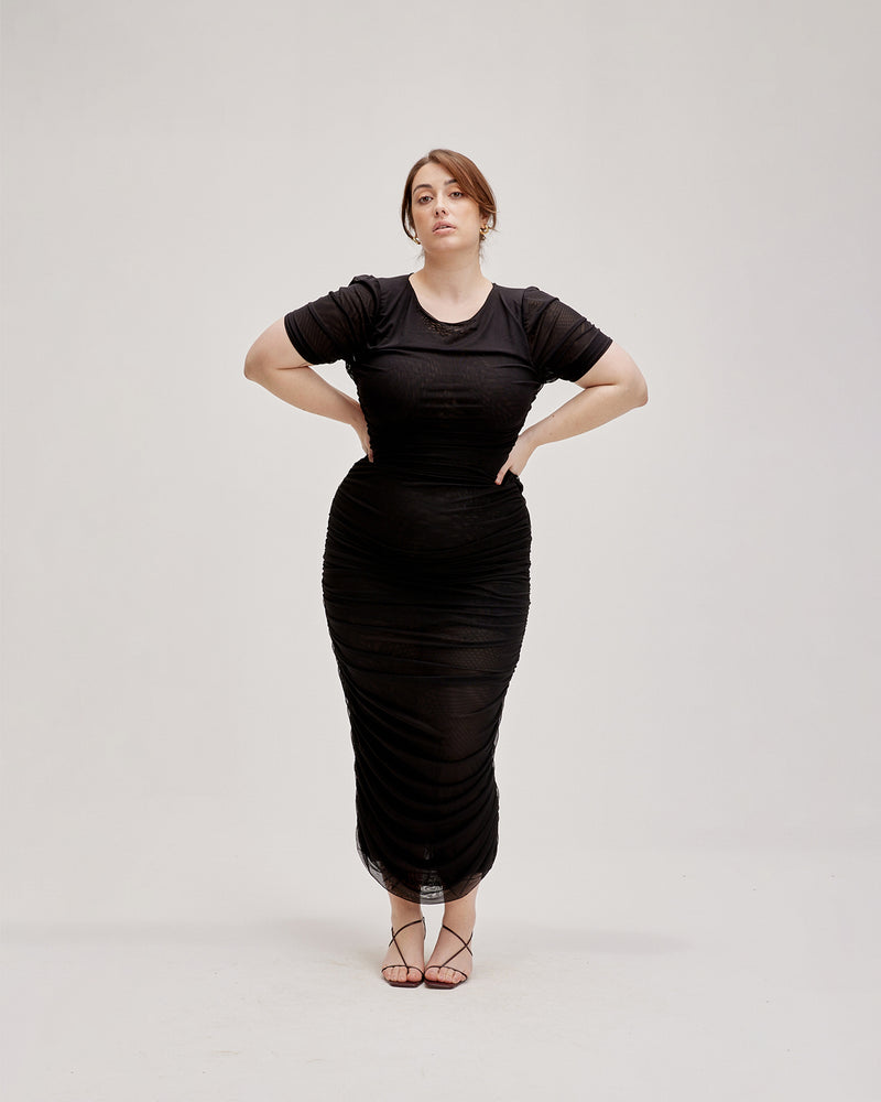 BOUNCE MESH DRESS BLACK | Form fitting mesh t-shirt dress with gathered side seams that create a ruching, gently accentuating the contours of your silhouette. Created in a generously stretchy fabric, this dress turns to...