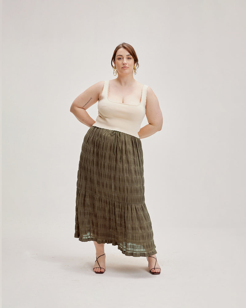 MIRELLA MAXI SKIRT OLIVE | Tiered maxi skirt with a drawstring waist and tonal ties with gold hardware. Made in signature RUBY Mirella fabric, a delicate embroidered cotton that adds a light an airy aesthetic...