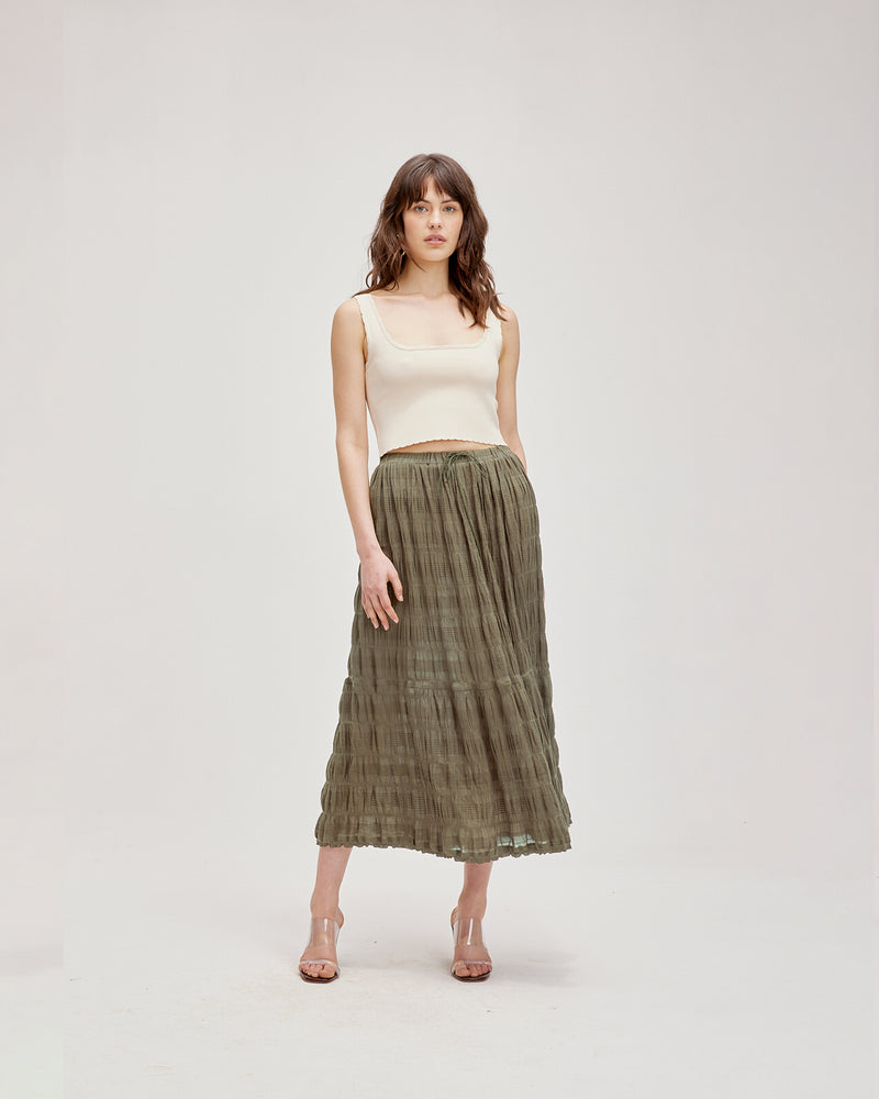 MIRELLA MAXI SKIRT OLIVE | Tiered maxi skirt with a drawstring waist and tonal ties with gold hardware. Made in signature RUBY Mirella fabric, a delicate embroidered cotton that adds a light an airy aesthetic...