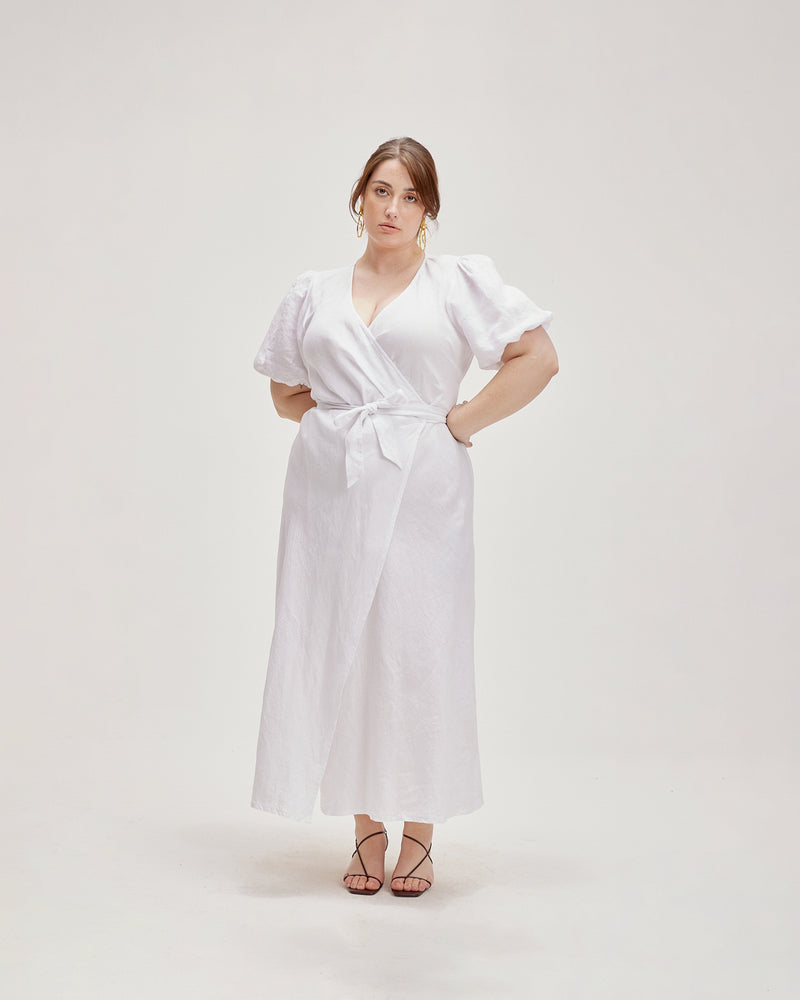 MELLOW LINEN WRAP DRESS WHITE | Puff sleeve midi wrap dress crafted in a crisp white linen. This dress is versatile and timeless.