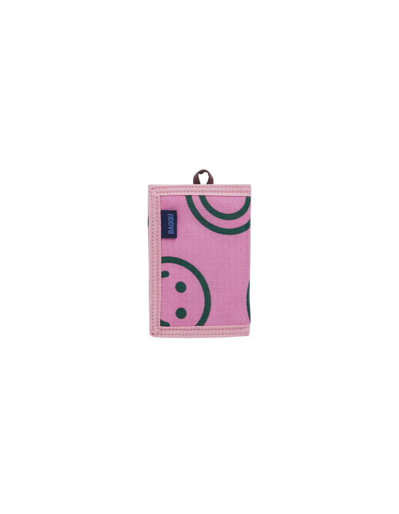 NYLON WALLET PINK | Trifold wallet with four card pockets, a bill fold and velcro closure in a happy print. Features a loop so you can clip it to your keychain or person.