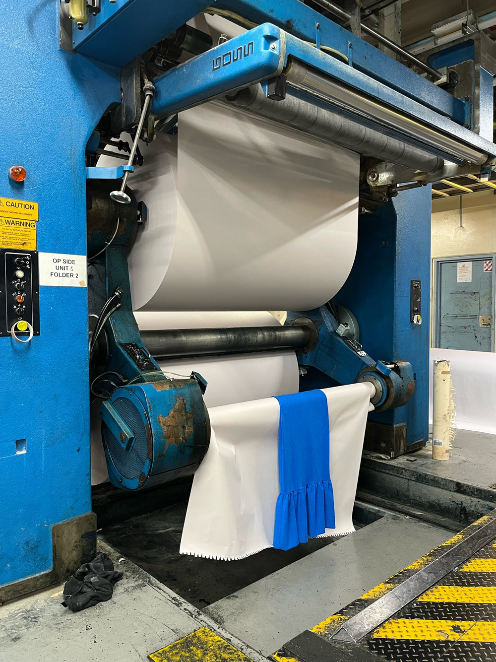 Bright blue dress rolls of the NZME paper printer