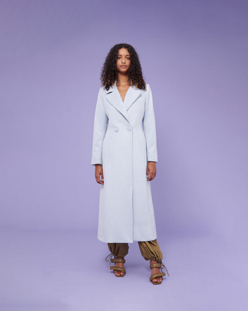 SCARLETT COAT BLUE | Longline coat with a classic double breasted silhouette pale blue houndstooth. Tailored in a weighty wool blend that adds structure to the piece, the pastel hues of this coat will...